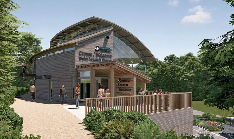 A mock-up of a wood clad building with step-free access