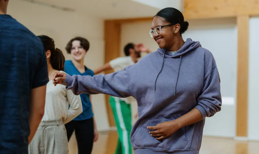 Shjodi Isonm taking part in a movement workshop with other young people