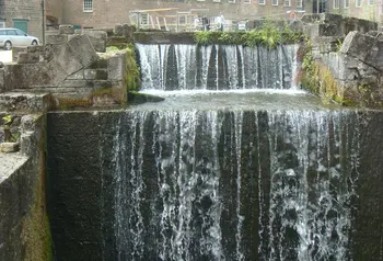 Cromford Mills waterfall and main building