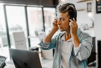 Man with headphones and computer