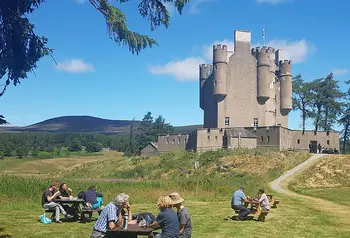 Visitors having picnics outside of Braemar Castle 