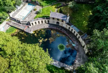 An aerial view of the crescent-shaped Cleveland Pools. A Georgian lido in Bath