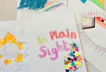 Colourful handmade poster for the In Plain Sight project. Rainbows, flowers and an eye decorated with LGBTQ+ colours can be seen