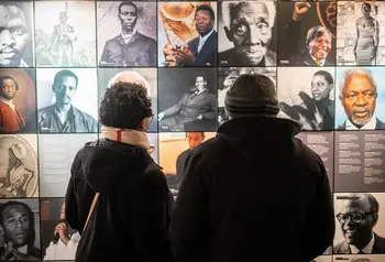 People viewing an exhibition at the International Slavery Museum