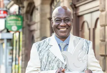 Maxwell Apaladaga Ayamba with lottery trophy