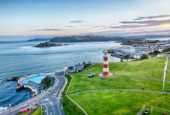 Aerial view of Plymouth's coast, with the lighthouse and lido in view