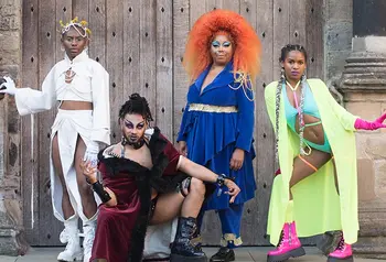 A group of black performers in colourful costumes at Stirling Castle