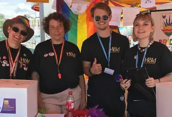 The Hold volunteers at their stand at Suffolk Pride