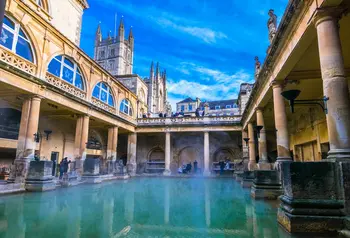 View of The Great Bath in Bath, Somerset, showing the water surrounded by Roman architecture. 