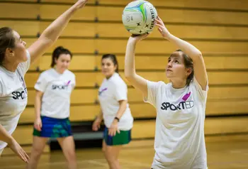 Young people playing netball