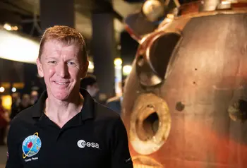 Time Peake next to the rocket that took him to space