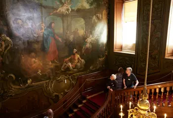 Visitors stand on the Hogarth Stair and look up at The Pool of Bethesda painting