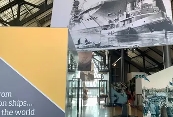 Banners and historic photographs inside the Shipbuilders Gallery.