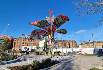 A colourful sculpture of an hibiscus flower