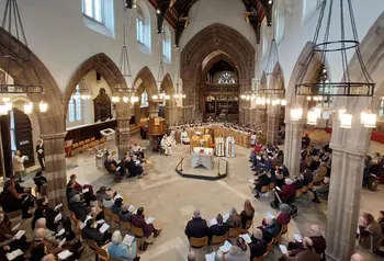 A photo of the inside of Leicester Cathedral during a service, taken from a high perspective within the building