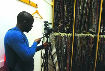 A participant photographing wax prints