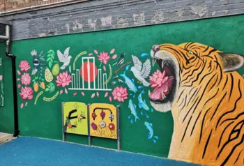 Photograph of a colourful wall mural featuring a tiger