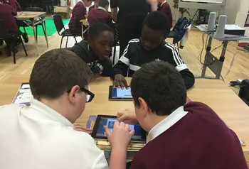 Young people developing graphic novels about history on ipads