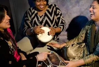 Women from the project take part in a drumming session 