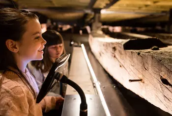 Children look at the remains of the Namur warship