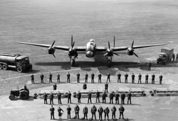 Units from Bomber Command line up in front of a Lancaster Bomber