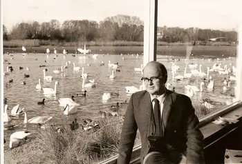 Sir Peter Scott in front of a lake