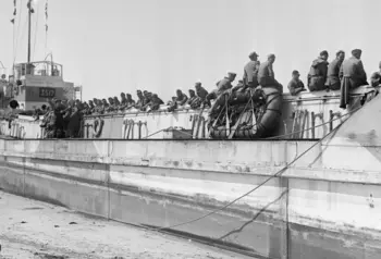 German prisoners await passage to England in a Landing Craft Tank