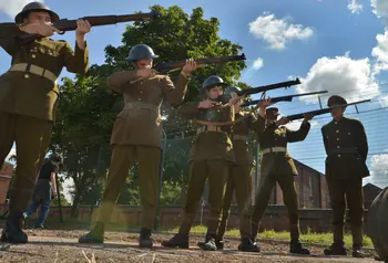 Men line up with guns to execute a soldier for cowardice. A still from ‘After Dawn’, the film created by young people at Central Youth Theatre.