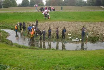 Young people and volunteers by the River Wandle