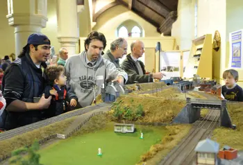 People look at a model railway