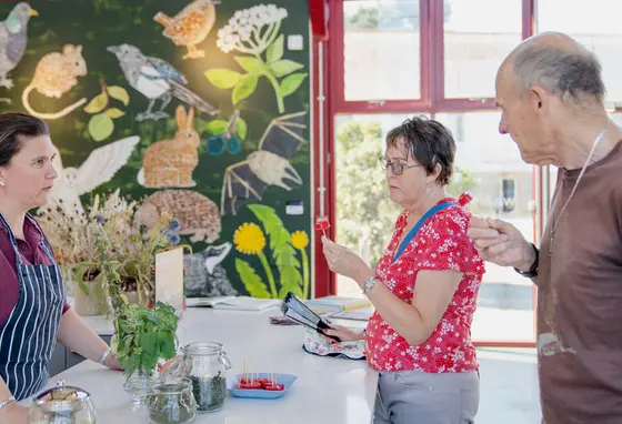 Visitors taste food made with ingredients found in hedgerows at The Food Museum