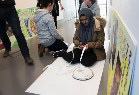 Young people working on the exhibition