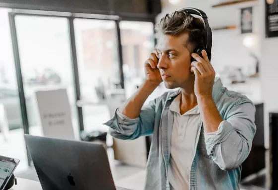 Man with headphones and computer