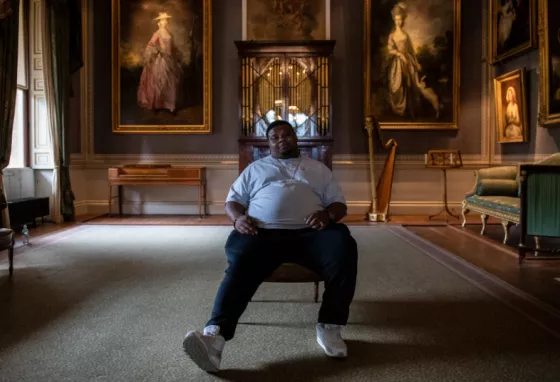 Big Narstie sitting in Kenwood House