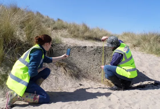 CITIZAN volunteers measuring on a beach