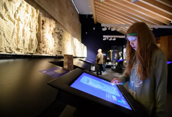 Child using a touch screen in an interactive exhibition 