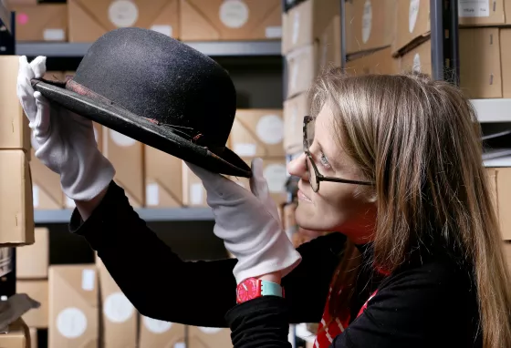 Kerry Vasiliou, Learning and Engagement Manager at the Blackpool Museum Project with Stan Laurel bowler hat