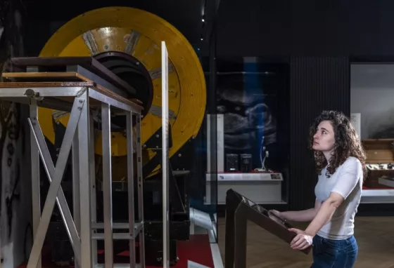 Girl looking at old MRI machine