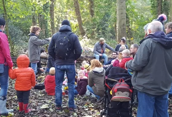 Parents and children in a wood