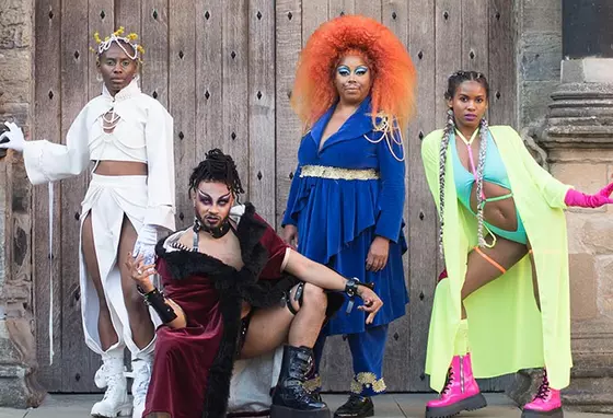 A group of black performers in colourful costumes at Stirling Castle