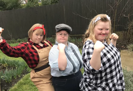 Three young people in war era clothing