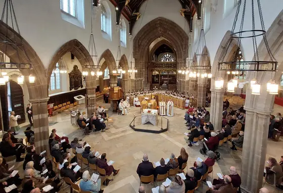 A photo of the inside of Leicester Cathedral during a service, taken from a high perspective within the building