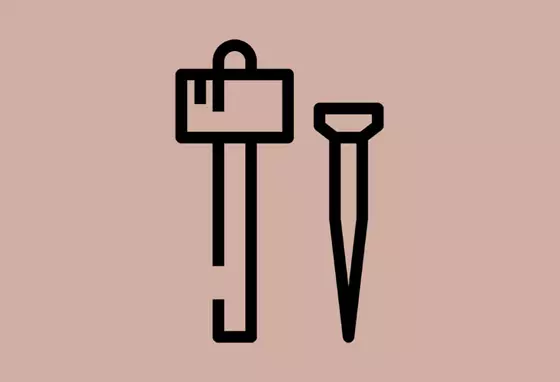 Black icons of a nail and mallet, representing traditional heritage building skills