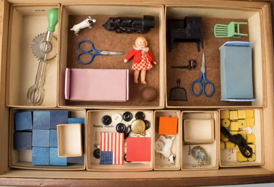 Photograph of various items in a wooden box