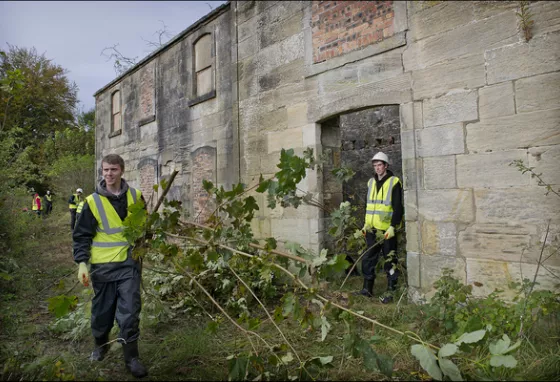 Two young men volunteering at Canal College