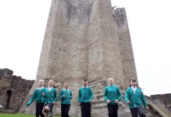 Pupils from Morley Place Junior School help celebrate the reopening of the revamped Conisbrough Castle. Photo Kippa Matthews