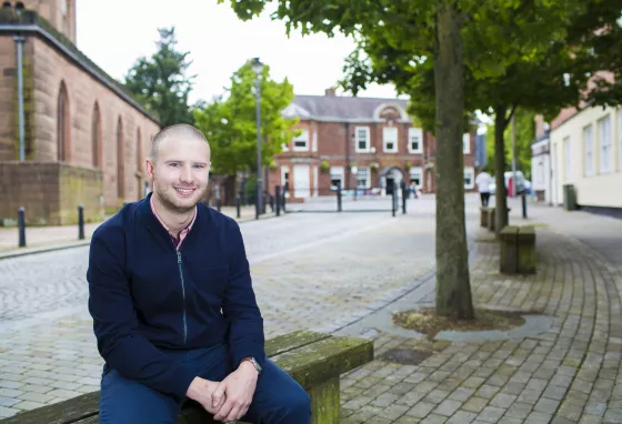 Daniel Longman sitting on a bench