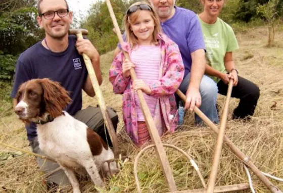 Volunteers at the Natural Futures project with tools used to maintain the natural environment