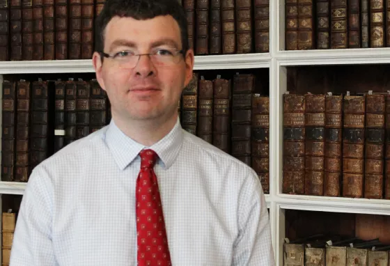 A man standing in a library