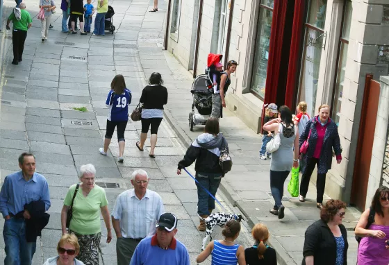 Visitors and shoppers on a street in Stromness